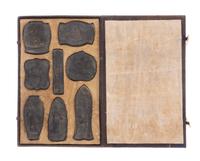 A Set of Eight Ink Cakes Length of longest 4 5/8 inches.