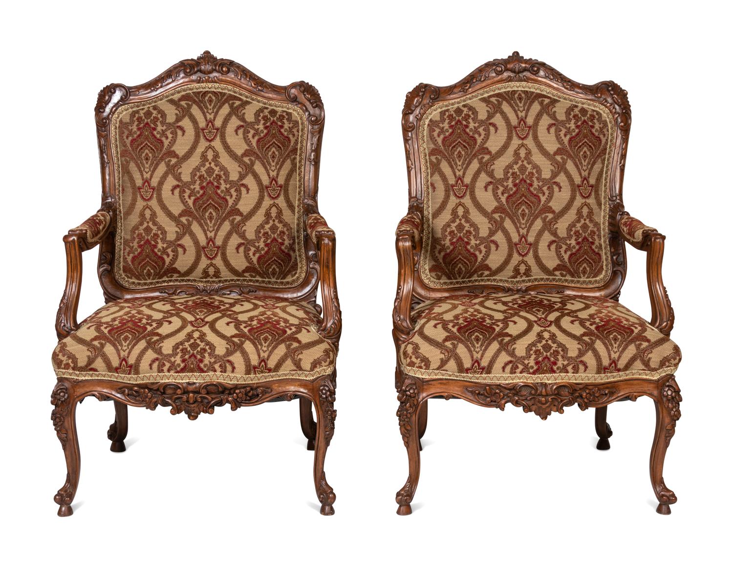 A Pair of Rococo Style Carved Walnut Armchairs