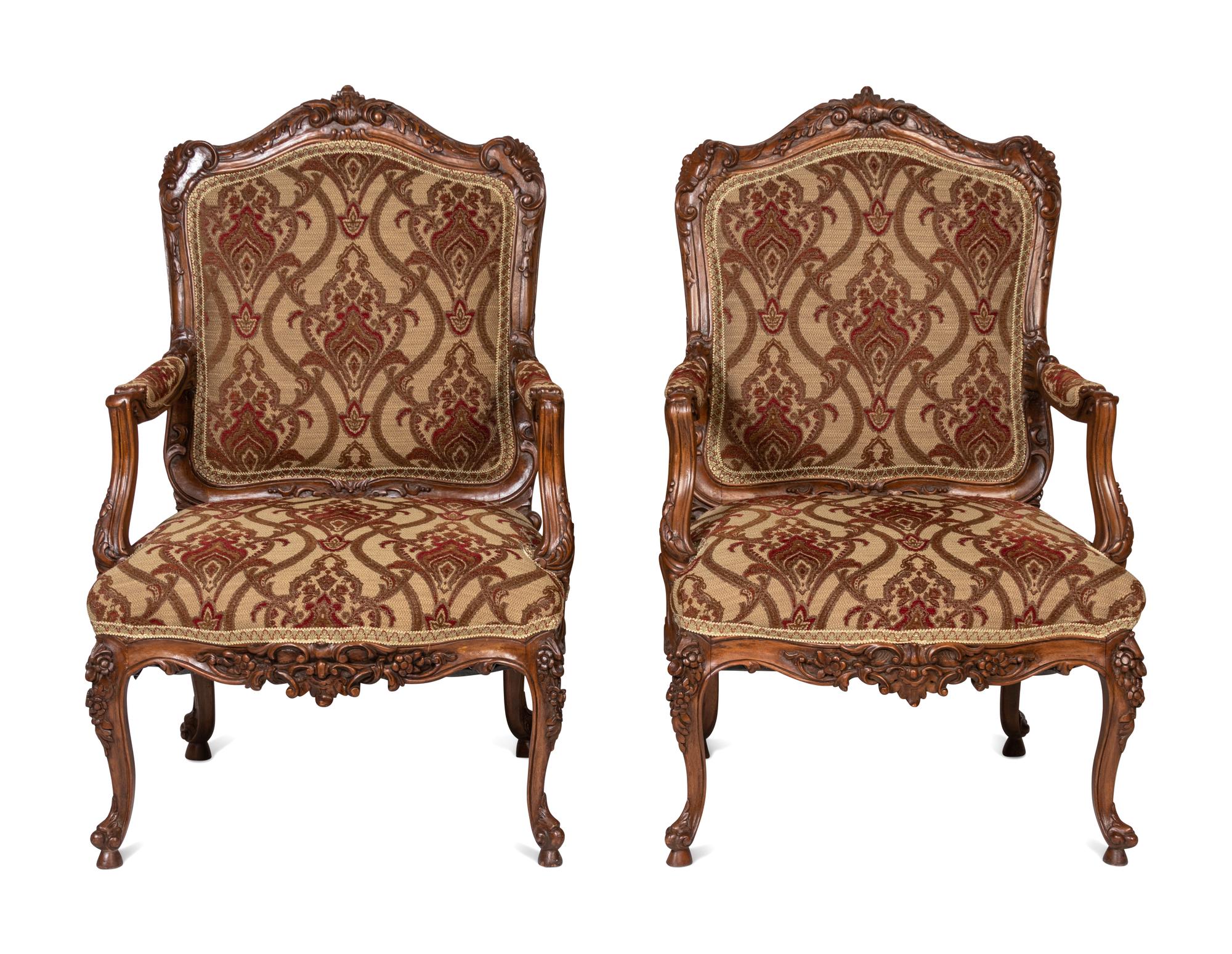 A Pair of Rococo Style Carved Walnut Armchairs