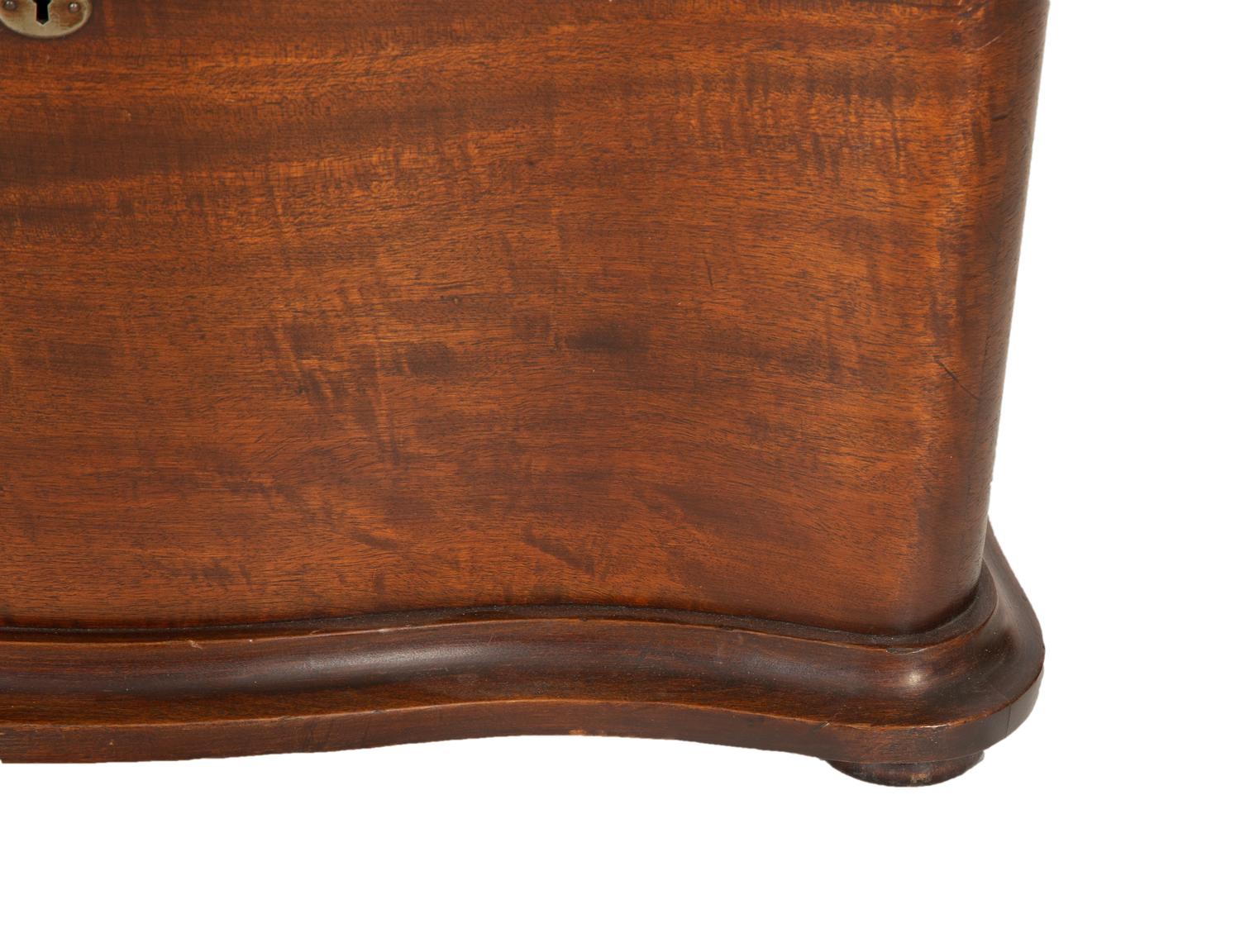 A Regina Mahogany Serpentine Cabinet Music Box