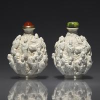 An Assembled Pair of Molded Porcelain "Lohan" Snuff Bottles, Qing Dynasty, Jiaqing Period — 清嘉慶 白釉瓷胎模製十八羅漢鼻煙壺兩支