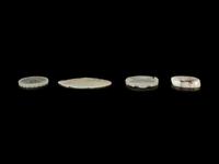 Four Chinese Jade Reticulated Pendants