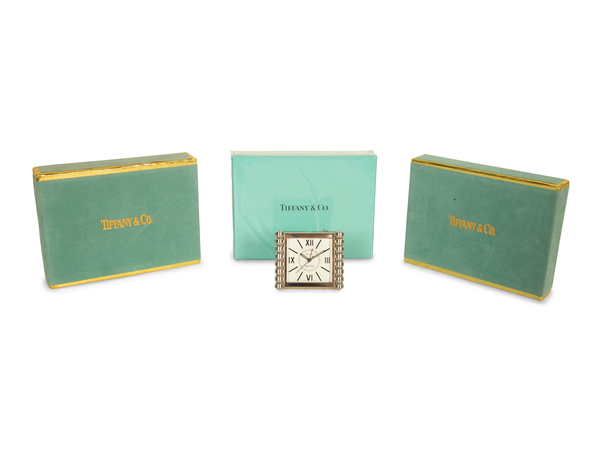 A Tiffany and Co. Travel Clock and Three Sets of Playing Cards