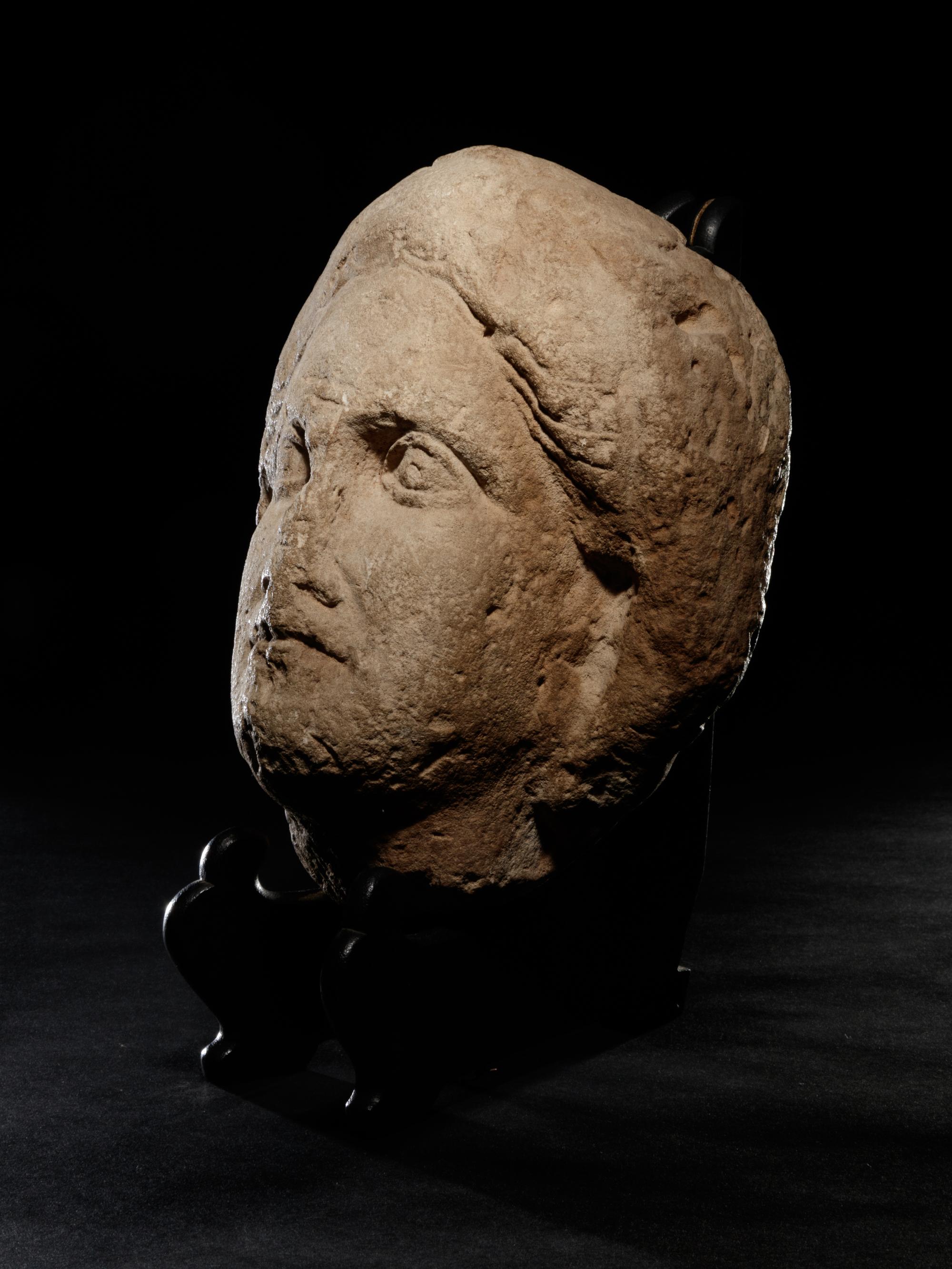 A Cypriot Limestone Head of a Goddess, Perhaps Aphrodite or Demeter