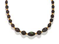 An Egyptian Hematite and Gold Bead Necklace