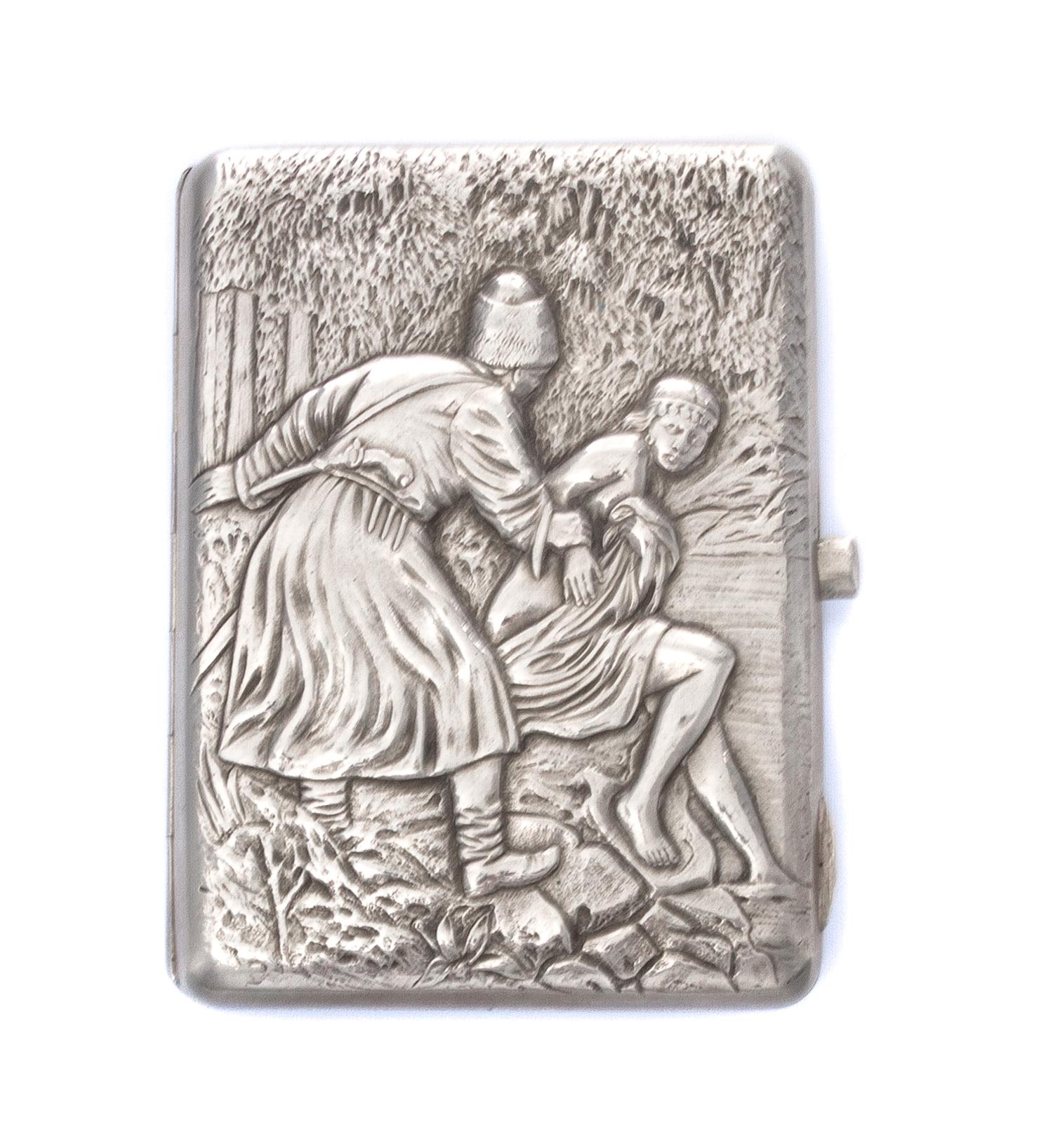 A Russian Silver Cigarette Case, , the lid worked to show a man grasping the arm of a draped woman by a spring.