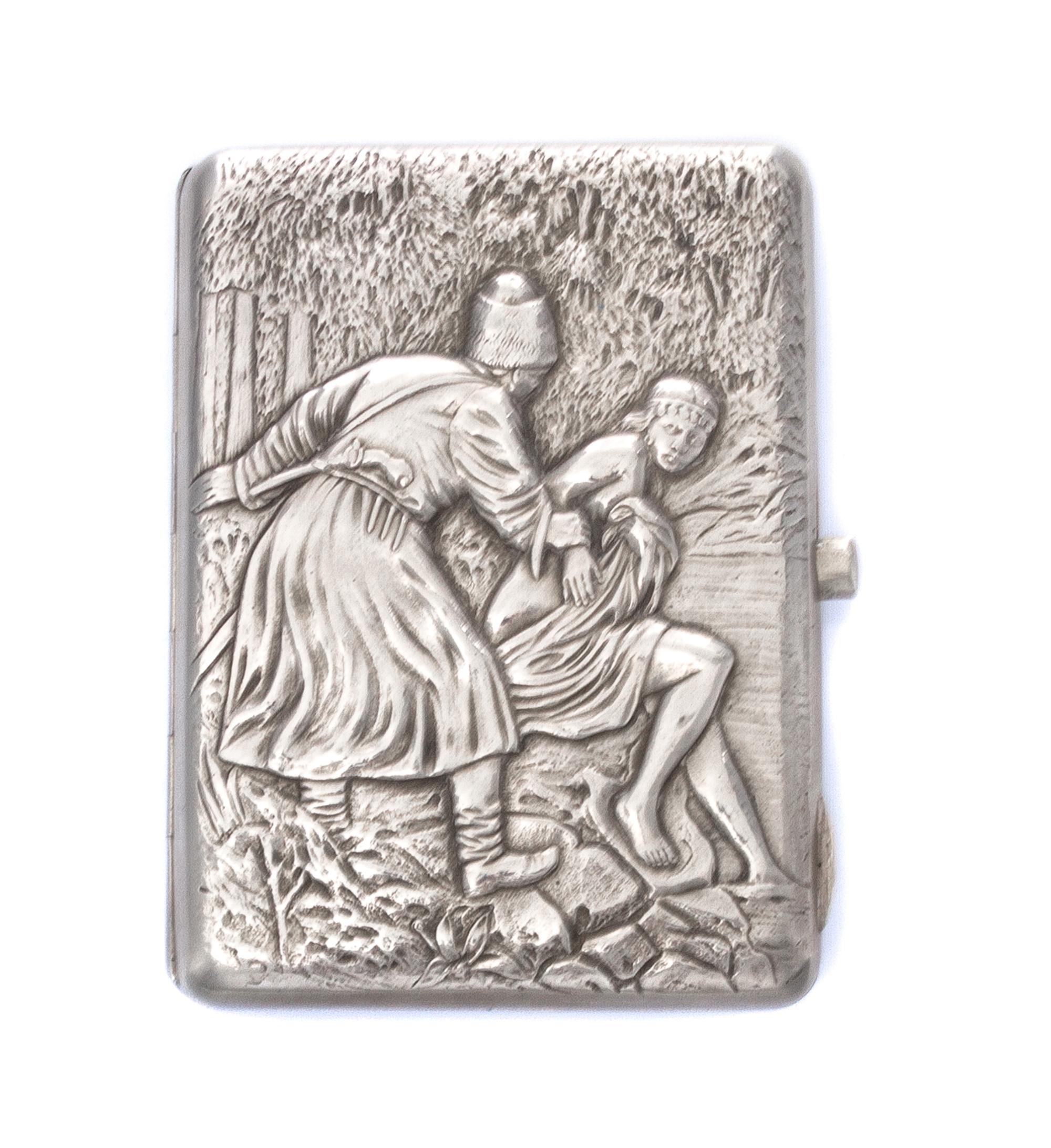 A Russian Silver Cigarette Case, , the lid worked to show a man grasping the arm of a draped woman by a spring.