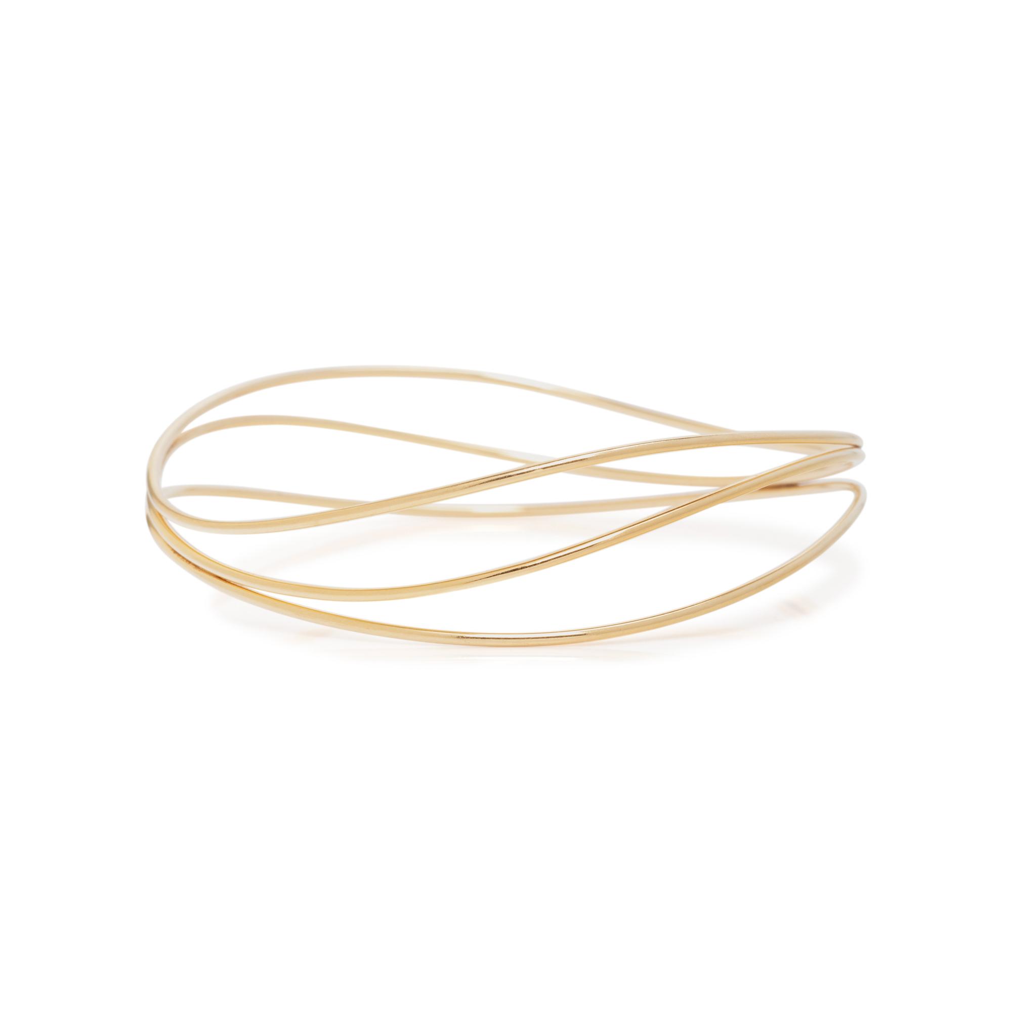 TIFFANY & CO., ELSA PERETTI, YELLOW GOLD 'WAVE' BANGLE BRACELET