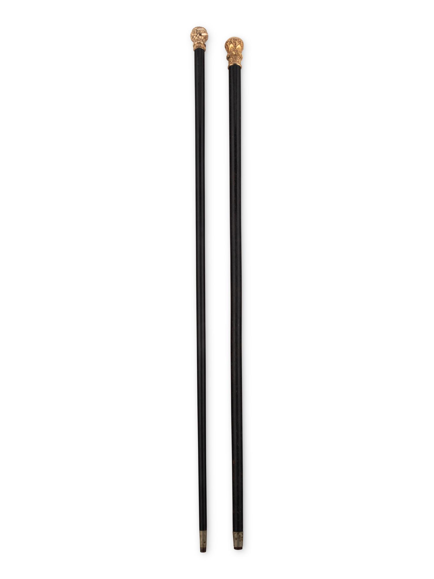 Two Gold or Gilt Metal Mounted Walking Sticks