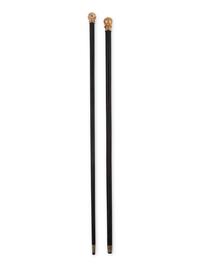Two Gold or Gilt Metal Mounted Walking Sticks