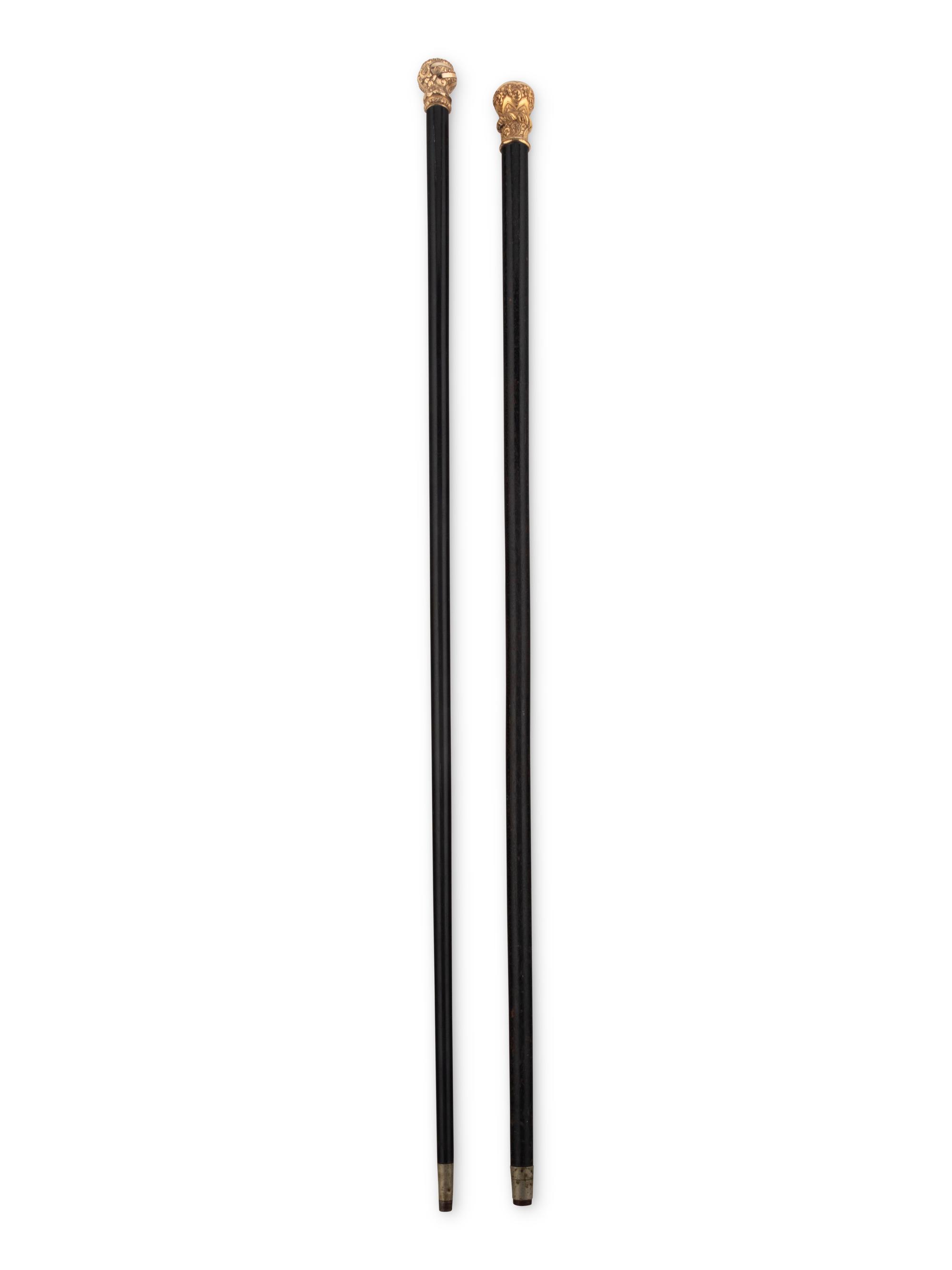 Two Gold or Gilt Metal Mounted Walking Sticks