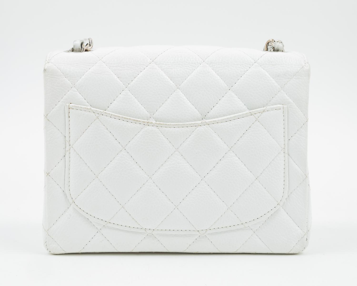 A Chanel White Caviar Mini Cross Body Flap Bag, 6.5" x 5.5" x 2.5"; Strap drop: 21"