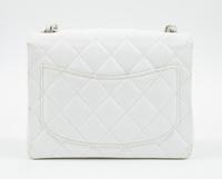 A Chanel White Caviar Mini Cross Body Flap Bag, 6.5" x 5.5" x 2.5"; Strap drop: 21"