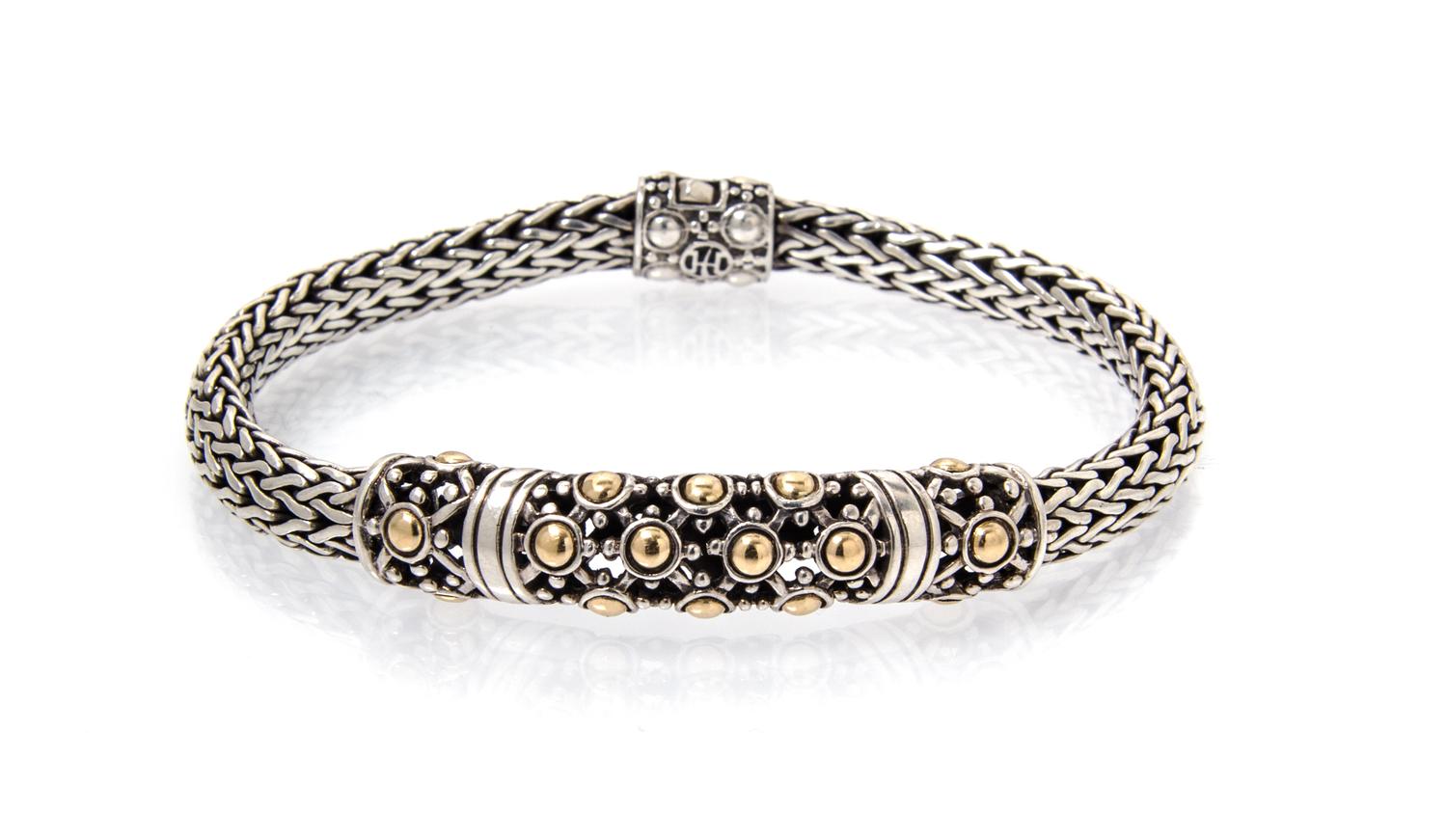 A Sterling Silver and 18 Karat Yellow Gold Bracelet, John Hardy, 17.00 dwts.