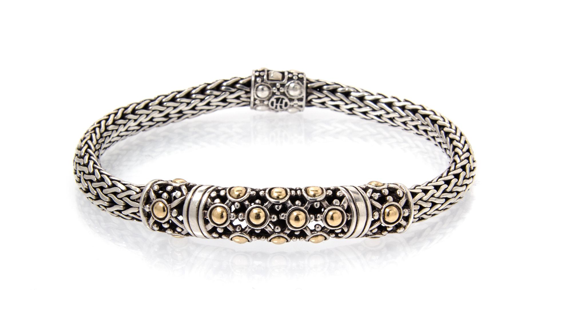 A Sterling Silver and 18 Karat Yellow Gold Bracelet, John Hardy, 17.00 dwts.
