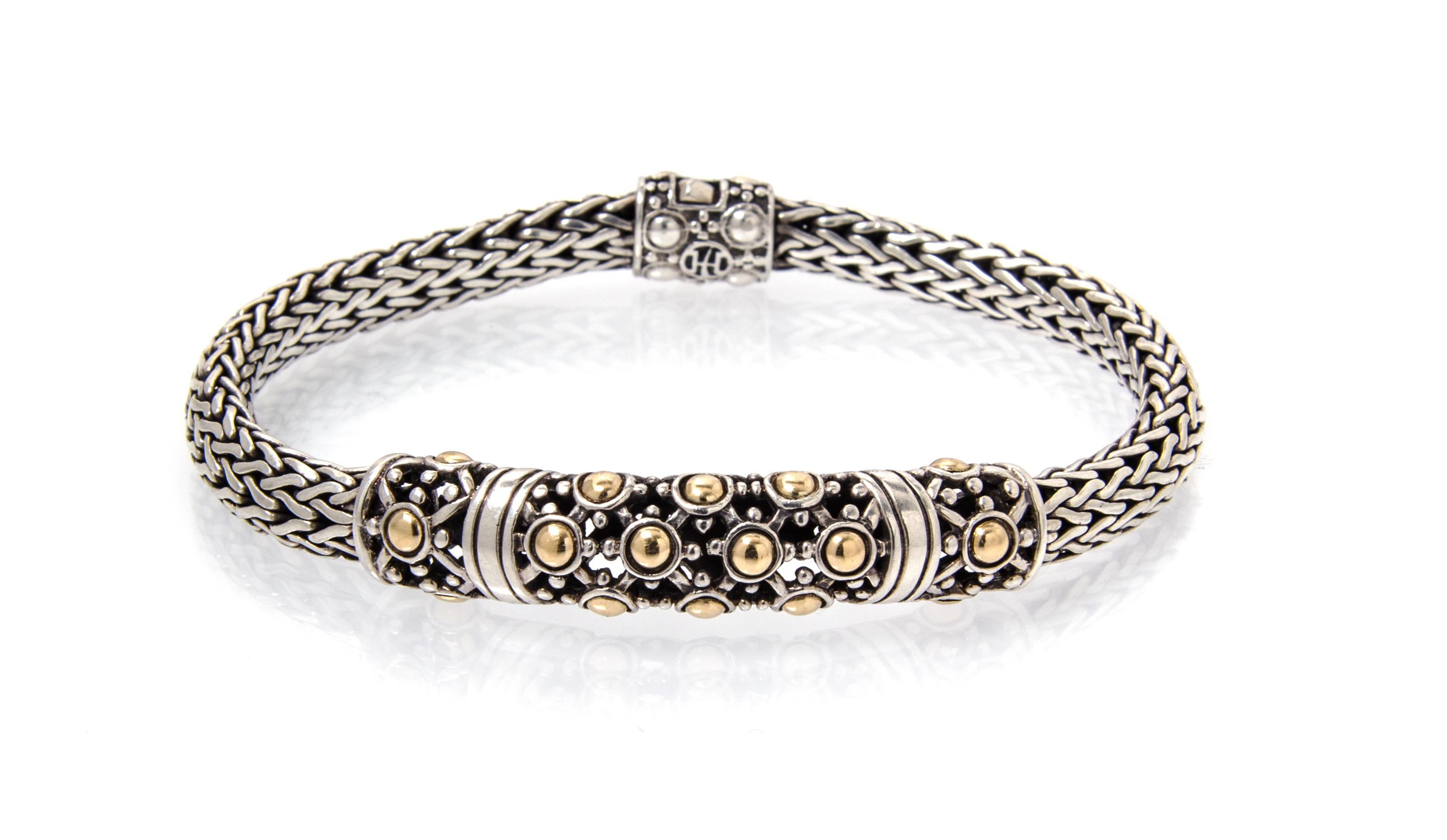 A Sterling Silver and 18 Karat Yellow Gold Bracelet, John Hardy, 17.00 dwts.
