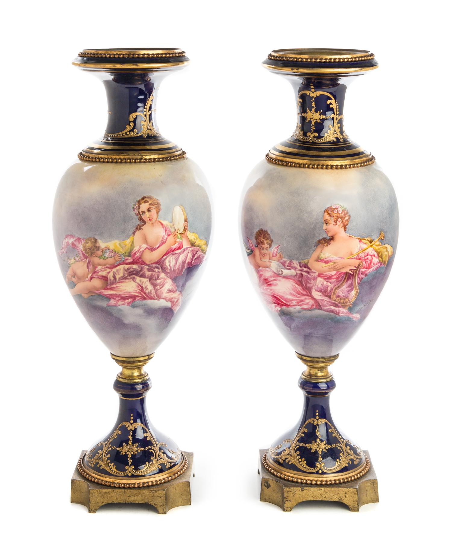 A Pair of Gilt Bronze Mounted Sevres Style Porcelain Urns Height 24 inches. — 19TH/20TH CENTURY