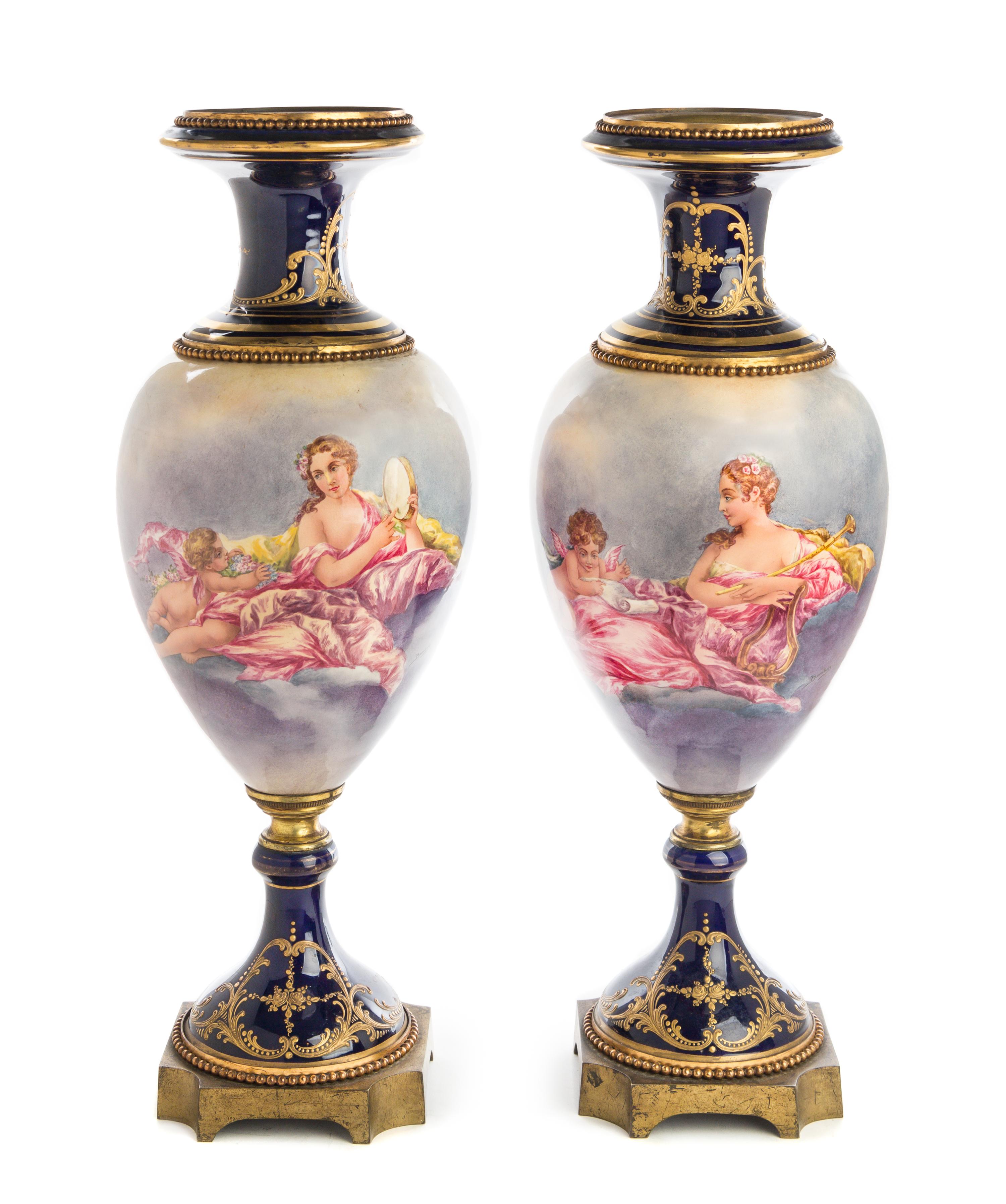 A Pair of Gilt Bronze Mounted Sevres Style Porcelain Urns Height 24 inches. — 19TH/20TH CENTURY