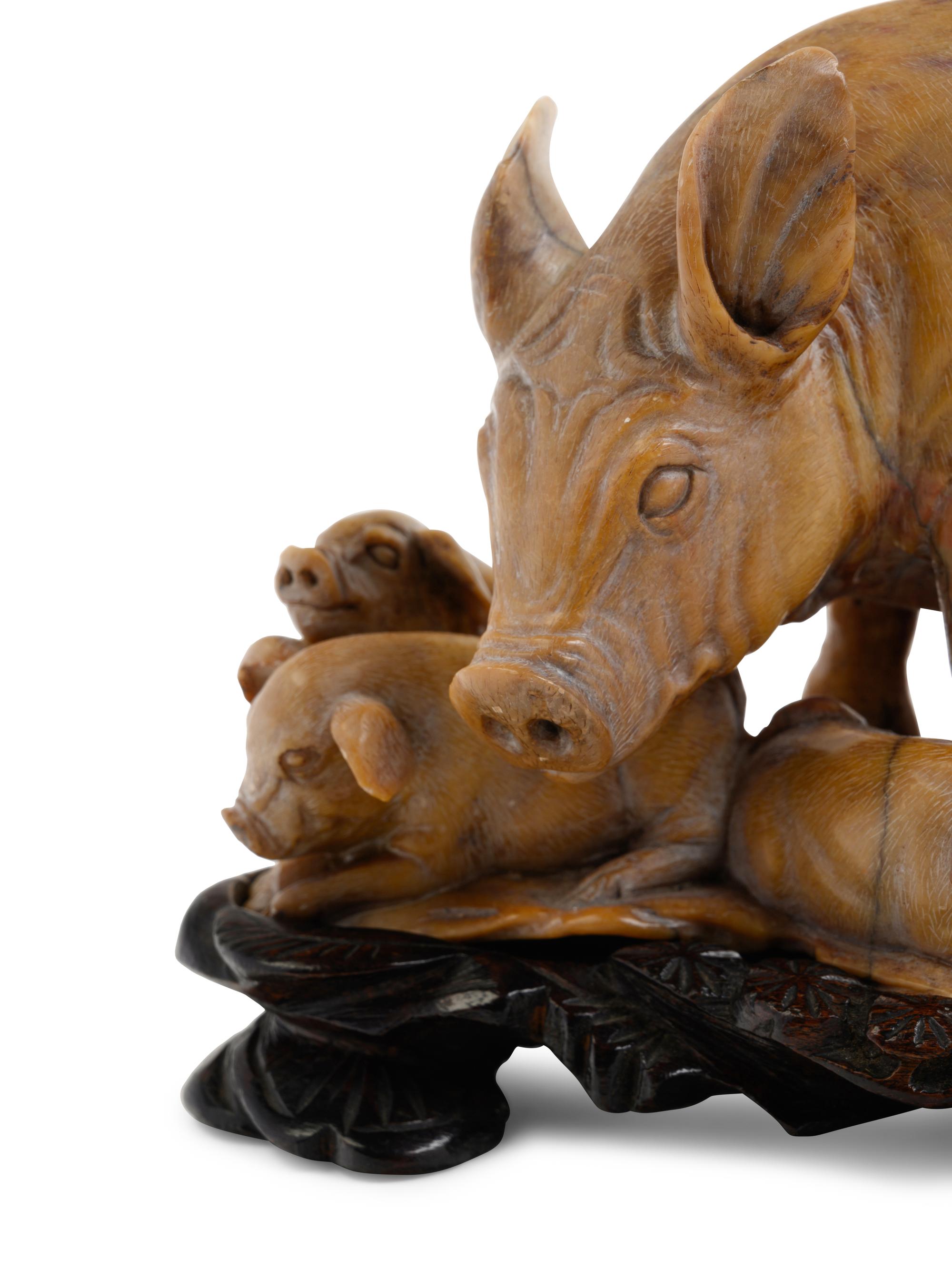 A Chinese Carved Soapstone Figure of Pig and Piglets