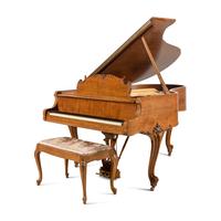 A Steinway and Sons Walnut Grand Piano