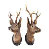 A Pair of Continental Painted Terracotta Deer Mounts