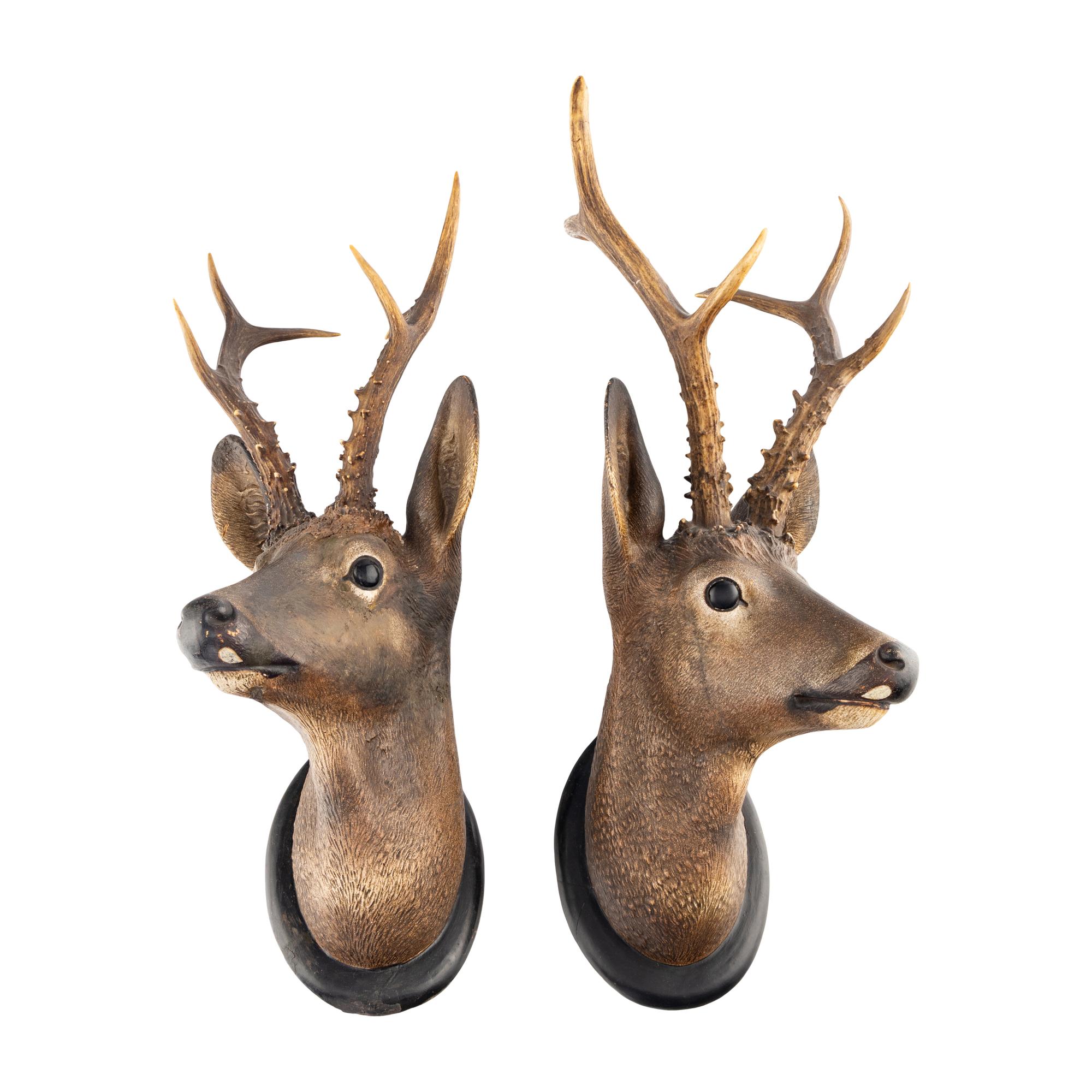 A Pair of Continental Painted Terracotta Deer Mounts