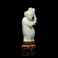 A Chinese Pale Celadon Jade Figure of a Boy, 18th-19th Century 清中期 青白玉 持蓮 童子