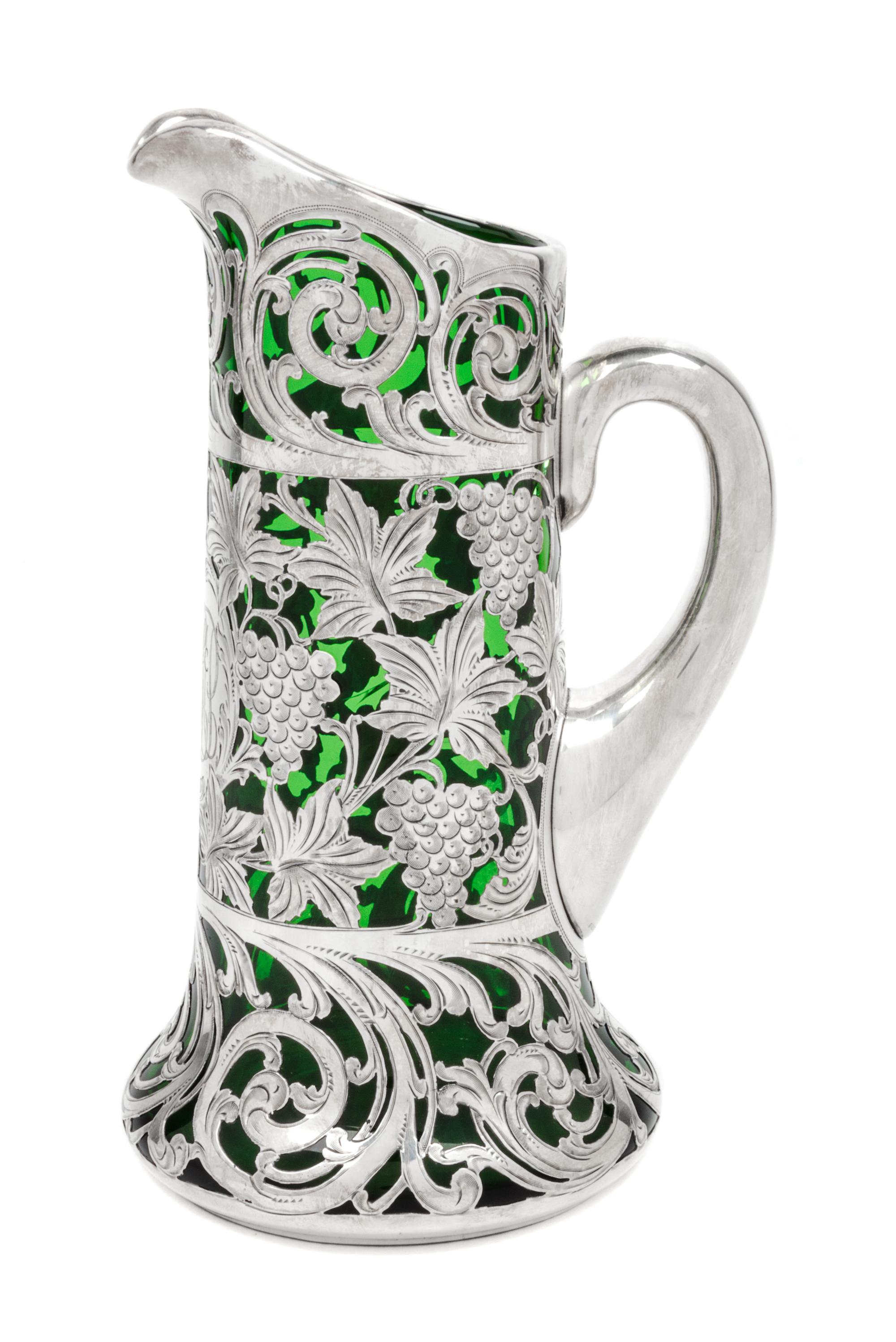 A Silver Overlay Glass Pitcher Height 9 1/8 inches.