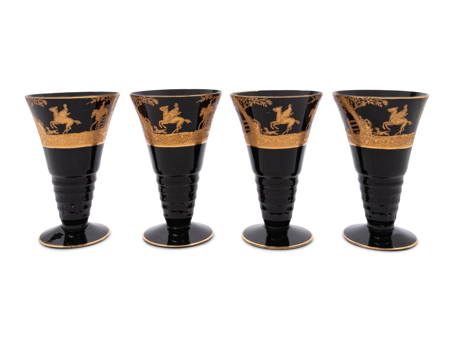 Four Continental Gilt Decorated Dark Amethyst Glass Goblets Depicting Hunting Scenes