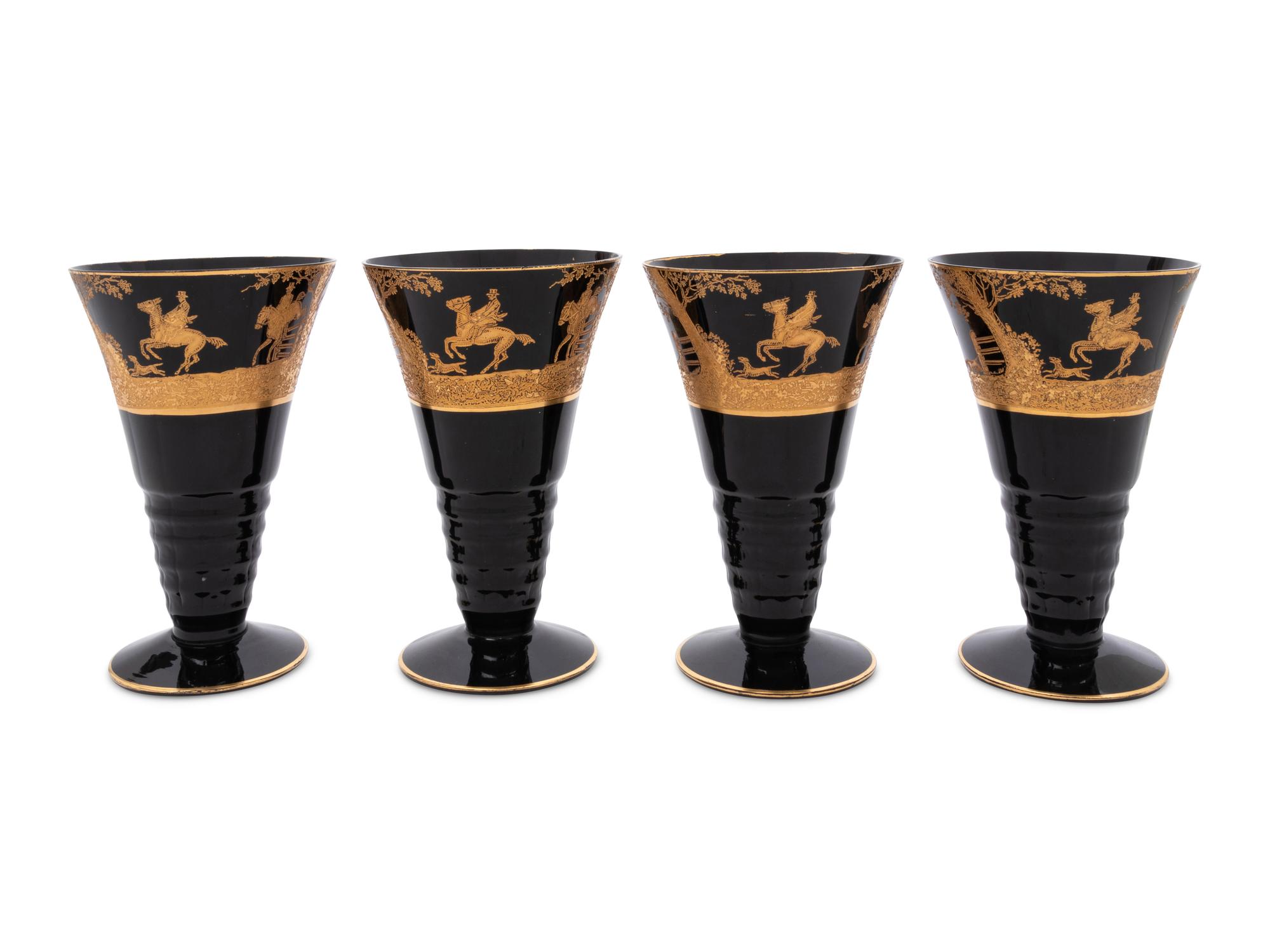 Four Continental Gilt Decorated Dark Amethyst Glass Goblets Depicting Hunting Scenes