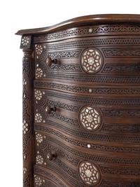 A Near Pair of Syrian Carved and Mother-of-Pearl Inlaid Walnut Serpentine Chest of Drawers