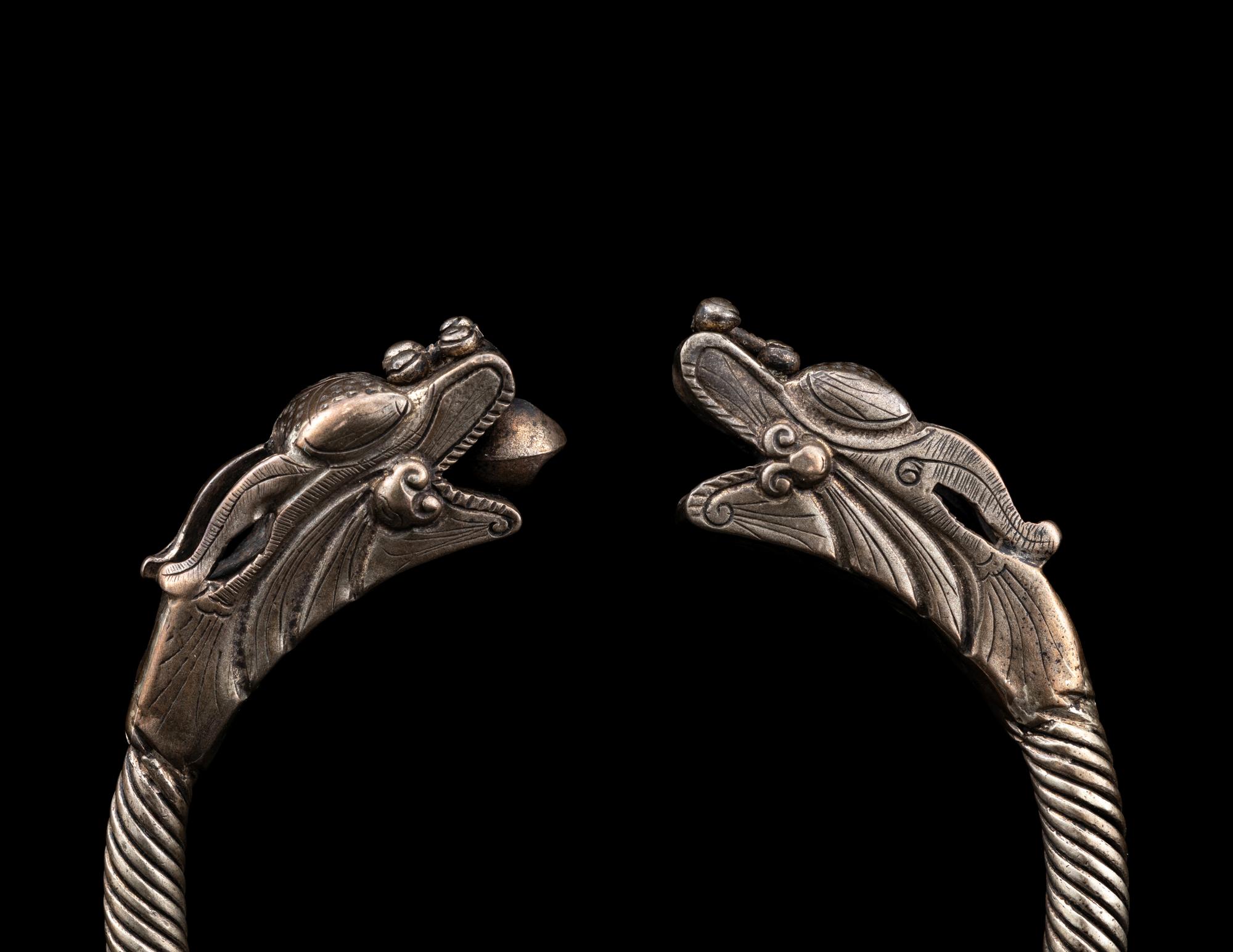 A Pair of Chinese Silver 'Dragon' Bangles