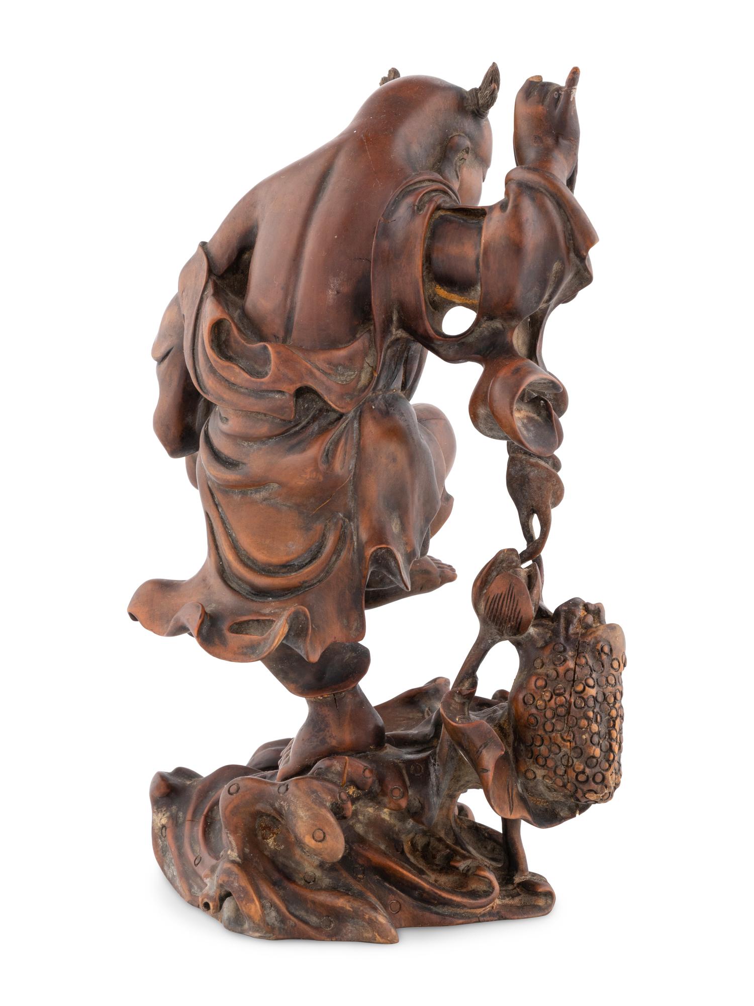 A Chinese Wood Figural Group of Liuhai and Three-Legged Toad