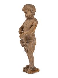 A Continental Carved Wood Putto