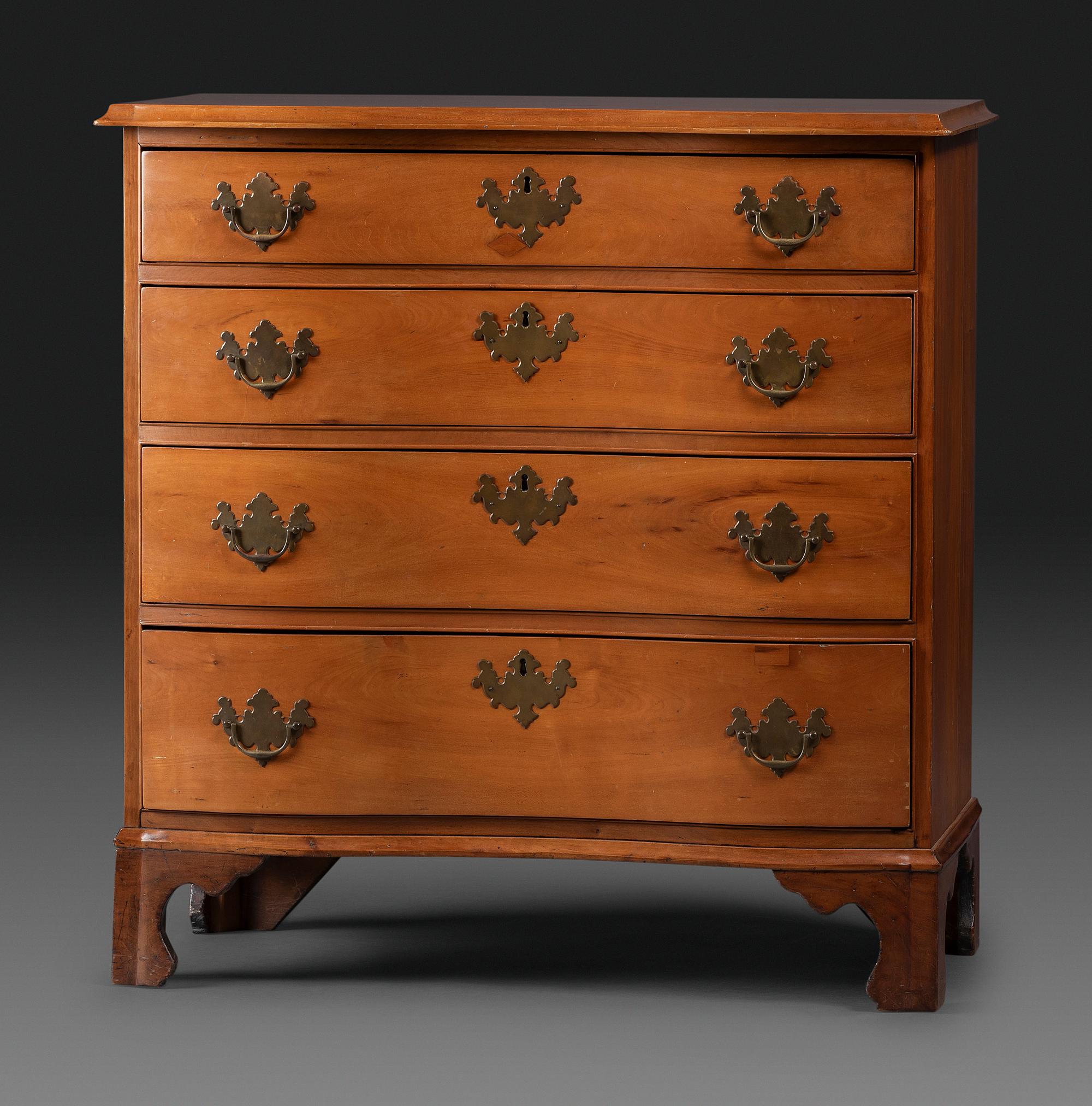 A Chippendale Cherrywood Reverse-Serpentine Chest of Drawers