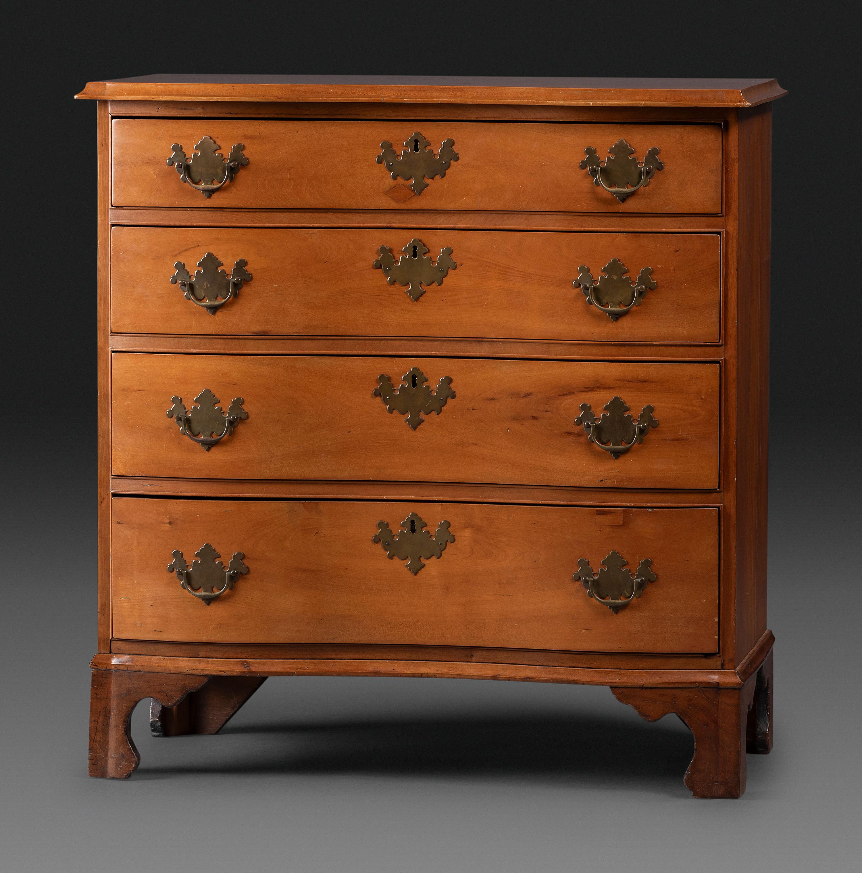 A Chippendale Cherrywood Reverse-Serpentine Chest of Drawers