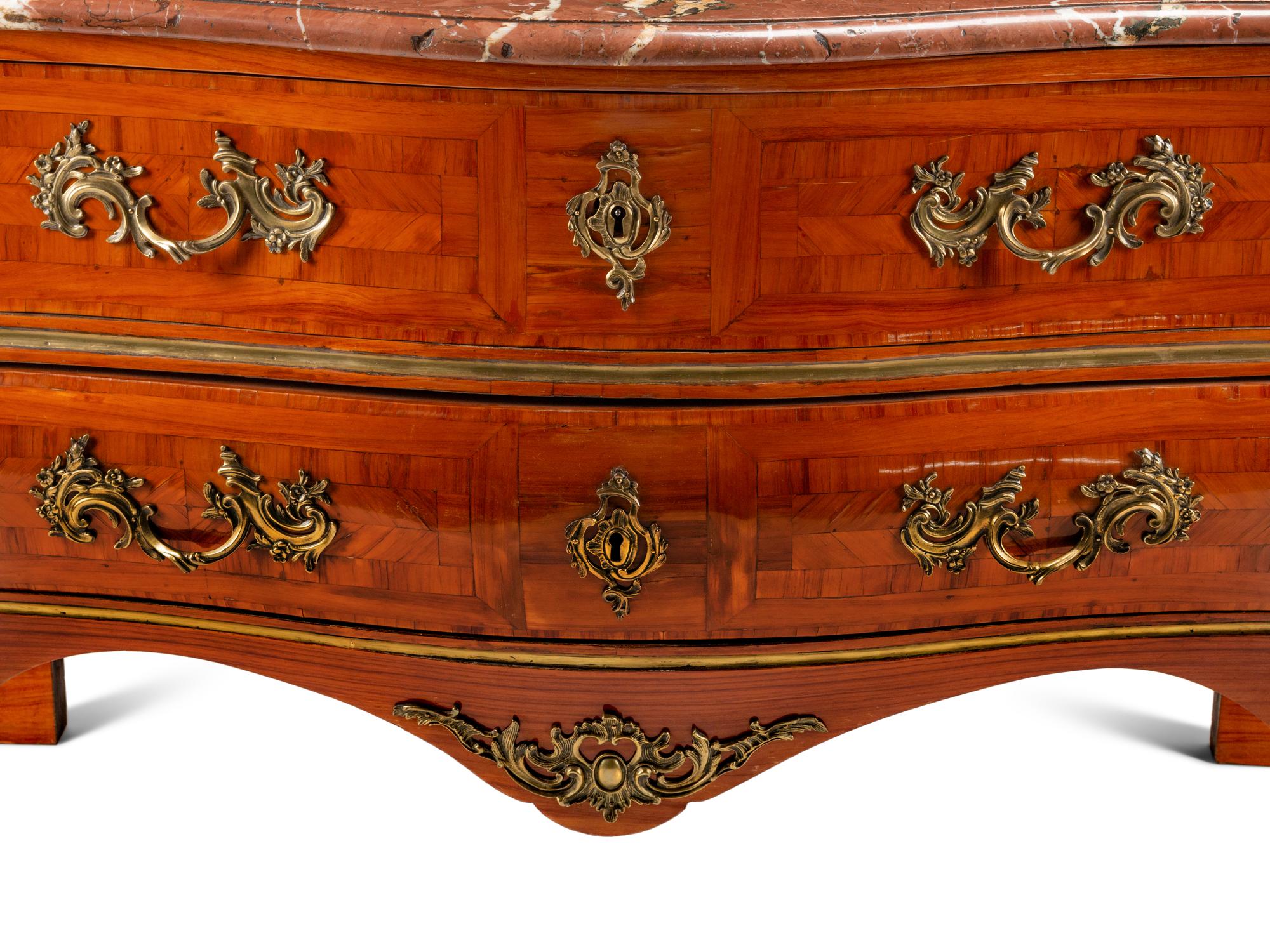 A Régence Style Gilt Bronze Mounted Parquetry Marble-Top Commode