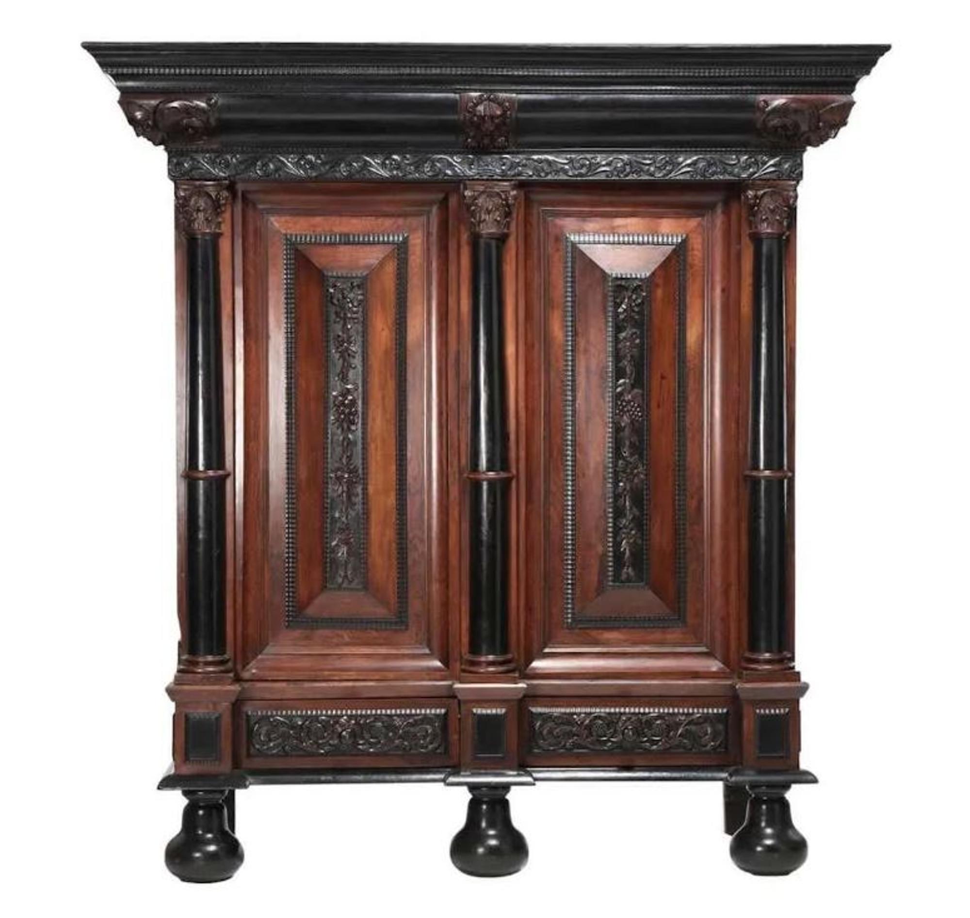 A Flemish Part-Ebonized Carved Rosewood Armoire — 17TH/18TH CENTURY