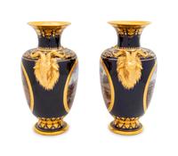 A Pair of Vienna Painted and Parcel Gilt Handled Porcelain Urns