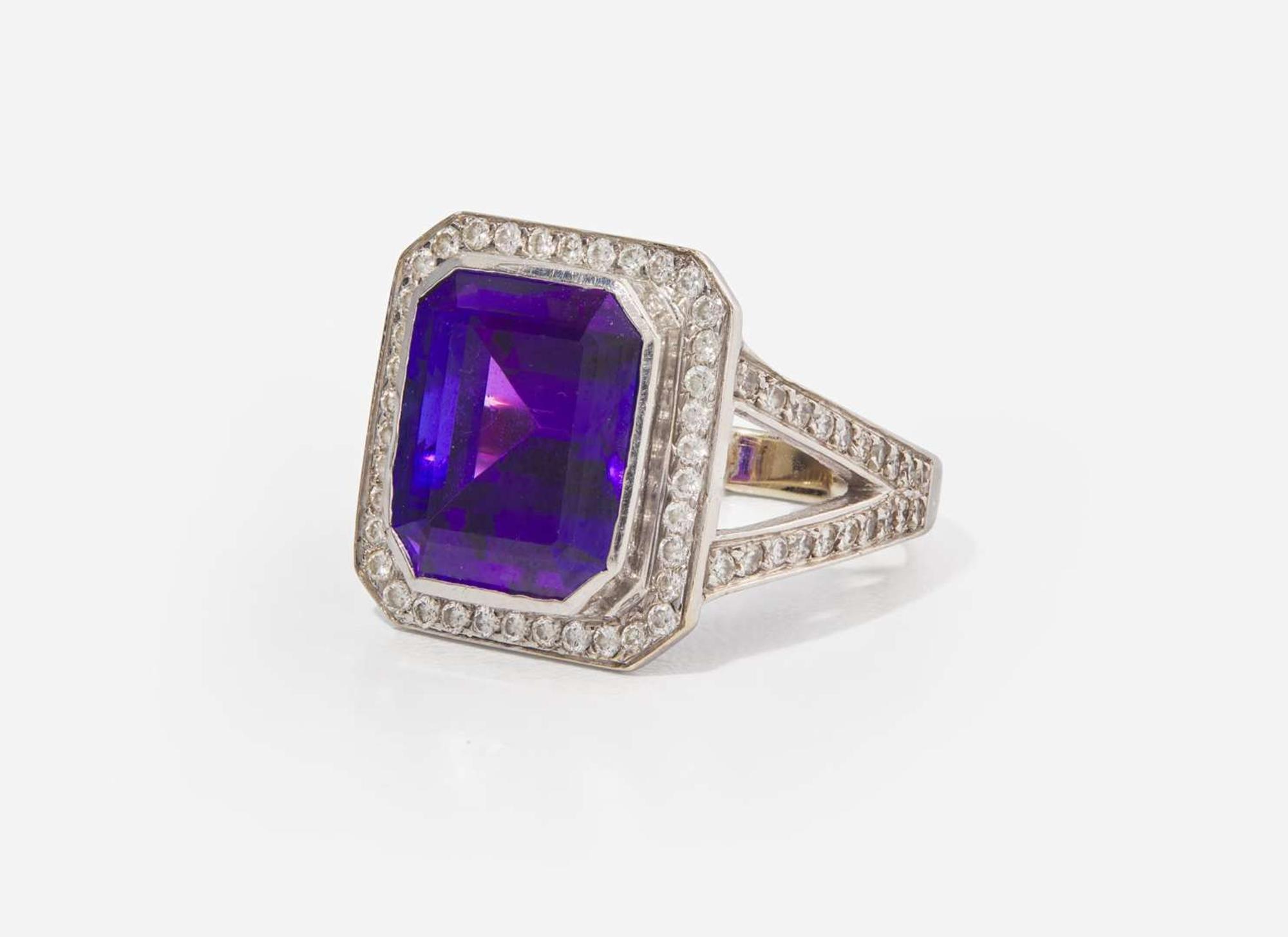 An 18K White Gold, Diamond, and Tanzanite Ring