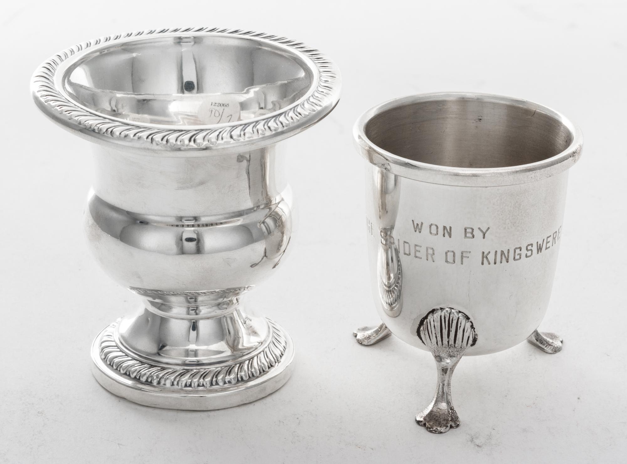 An American Silver Cigarette Urn, , campagna form with gadrooned rims and weighted base, together with another cigarette urn on three s