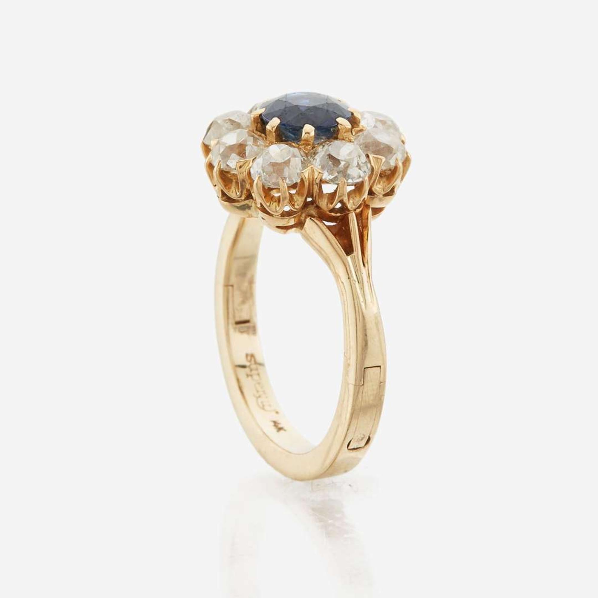 A sapphire, diamond, and gold ring