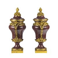 A Pair of Gilt Bronze Mounted Porphyry Urns