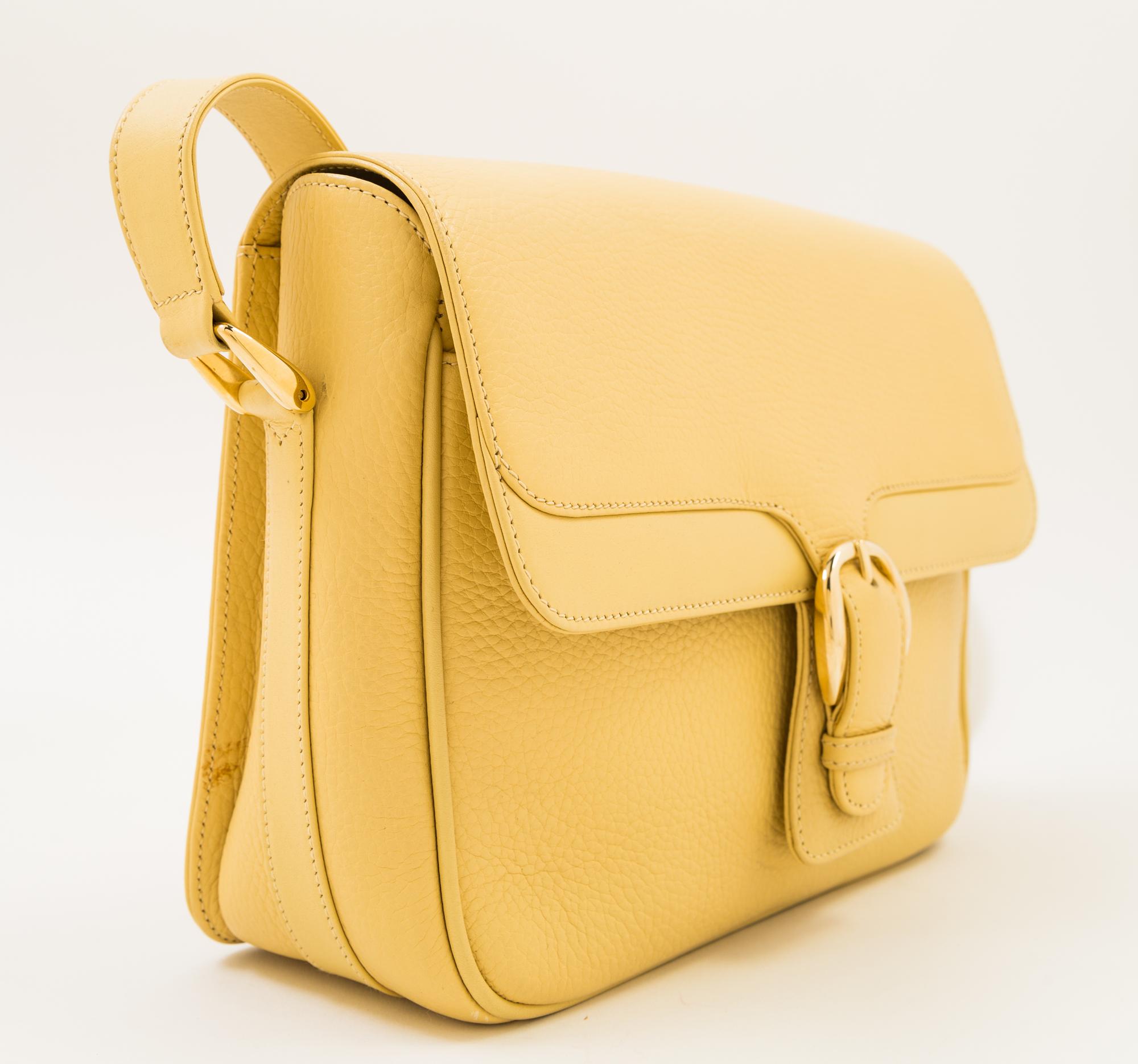A Gucci Pale Yellow Leather Flap Handbag, 10" x 8" x 3"; Strap drop: 20".