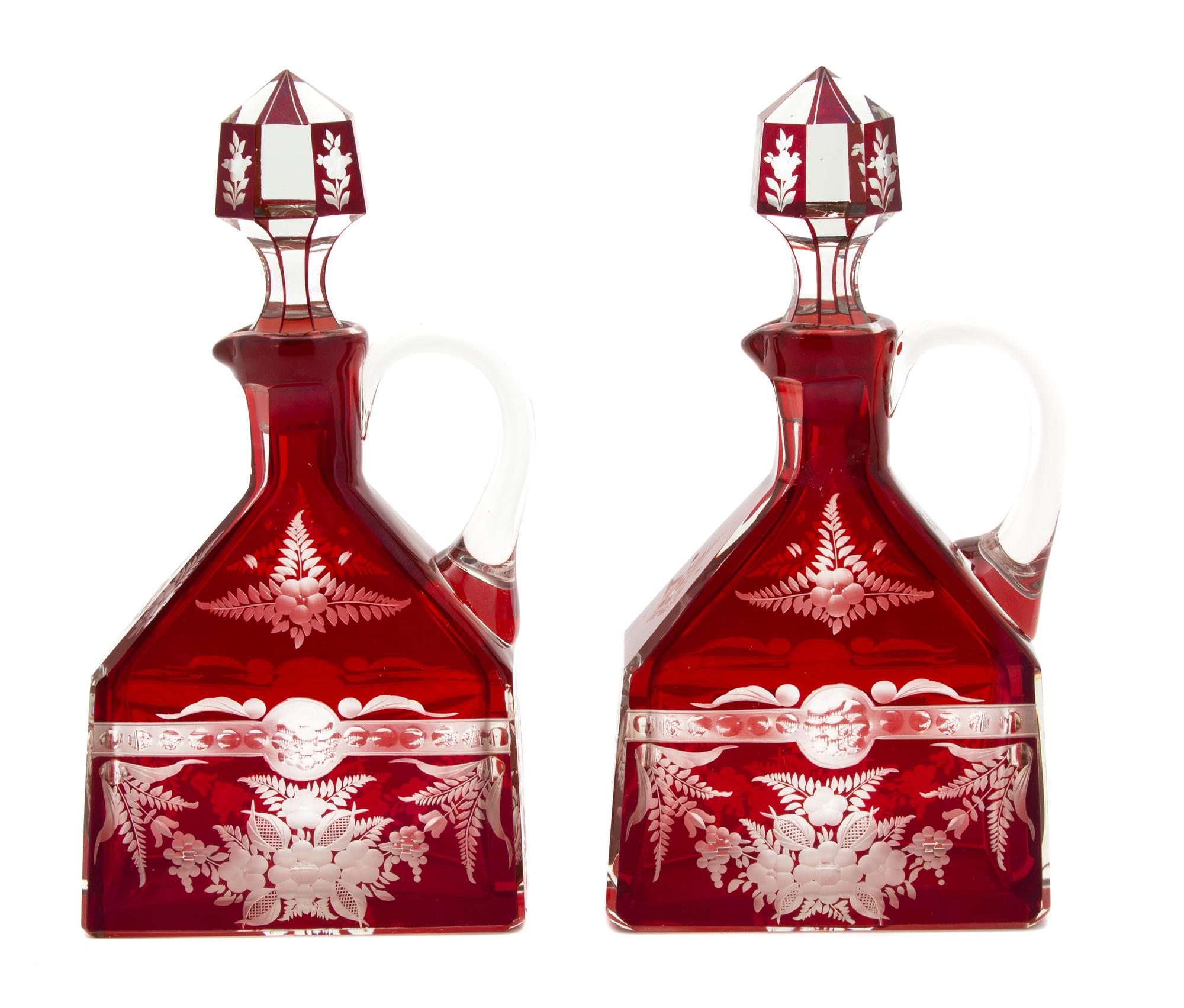 A Pair of Bohemian Cranberry Flashed Glass Decanters Height 10 1/4 inches. — 19TH CENTURY