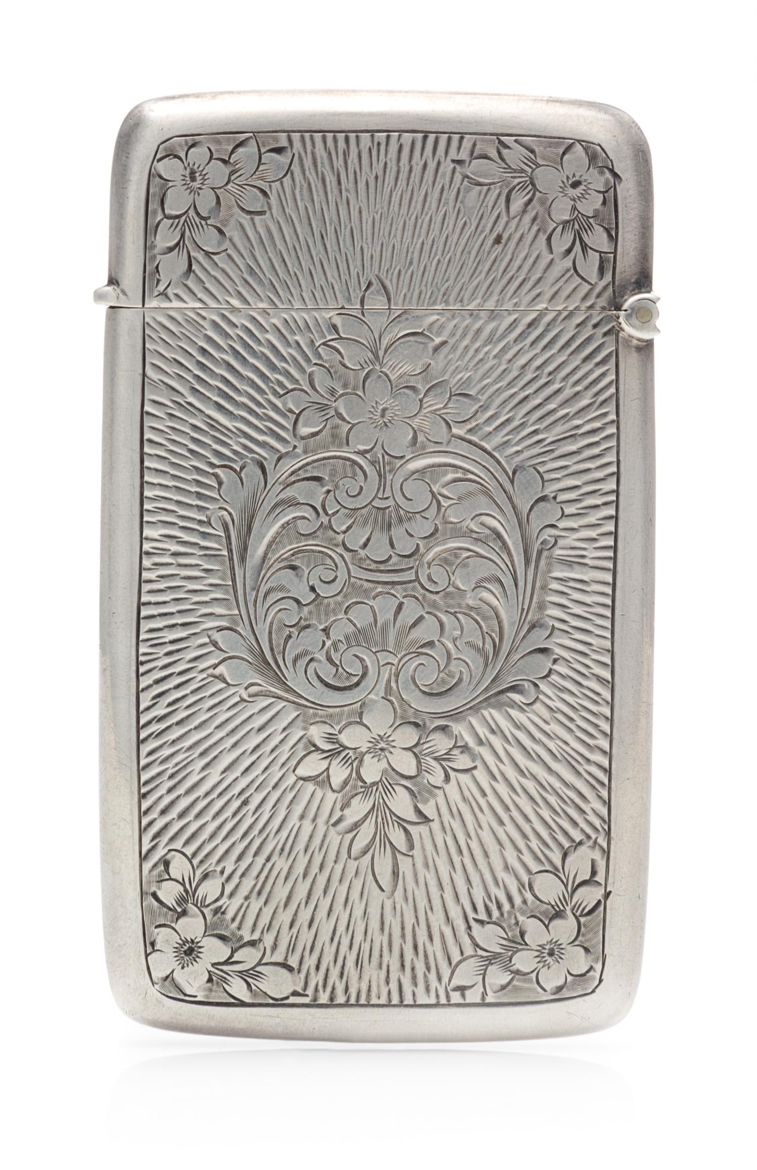 An Edwardian Silver Vesta Case, Maker's Mark Obscured, Birmingham, 1908, the case worked with S-scroll and floral elements and centered