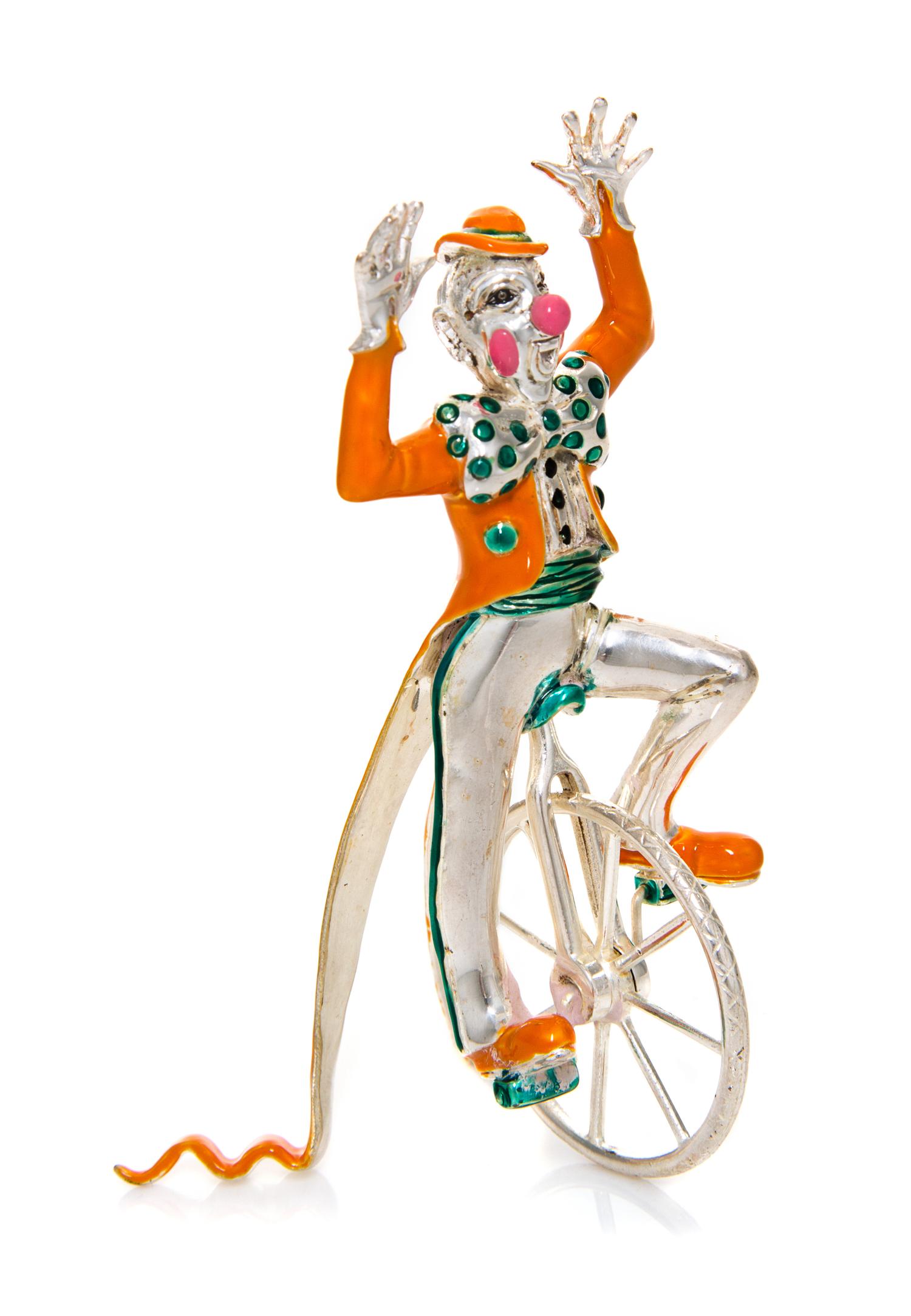 An American Silver and Enamel Circus Figure, Gene Moore for Tiffany & Co., New York, NY, depicitng a clown wearing a hat and tails ridi