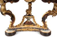 A Continental Parcel Gilt and Ebonized, Pietra Dura and Abalone Inlaid Center Table