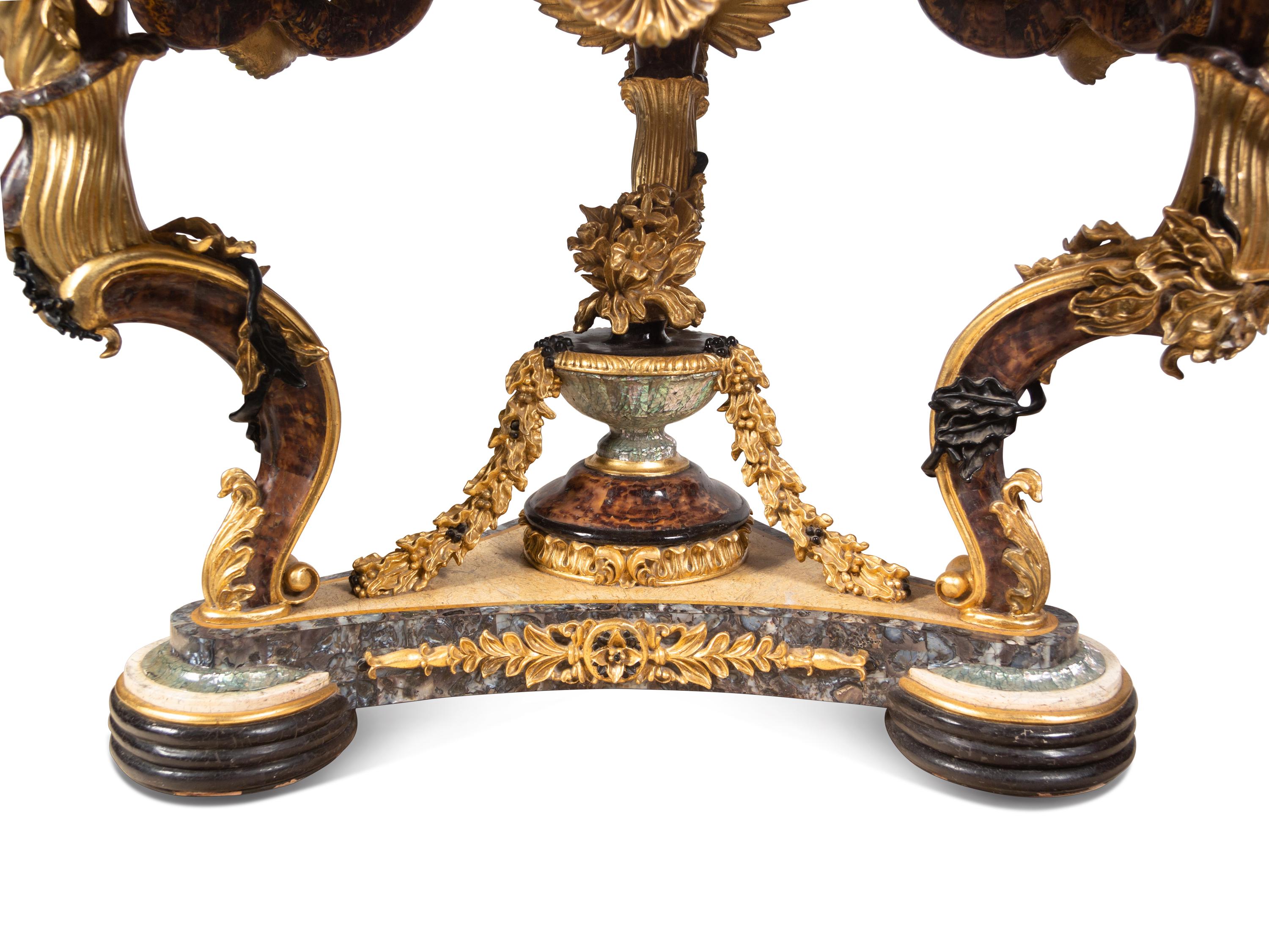 A Continental Parcel Gilt and Ebonized, Pietra Dura and Abalone Inlaid Center Table