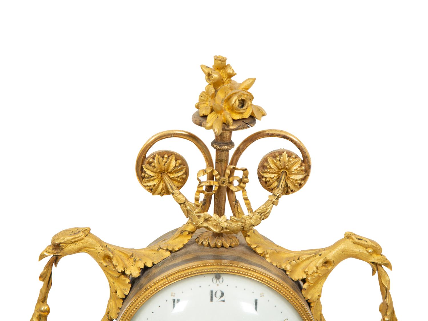 A Louis XVI Gilt Bronze and Marble Mantel Clock